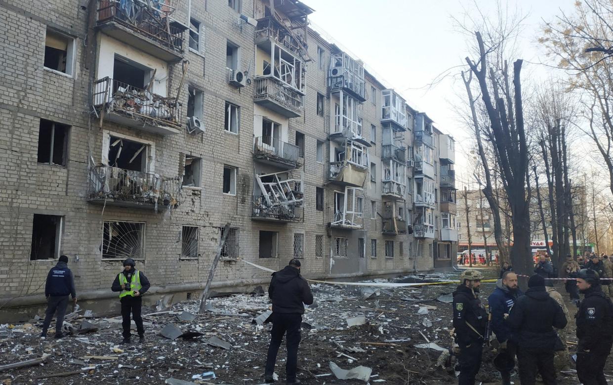 Police at the site of a Russian military strike on Kharkiv