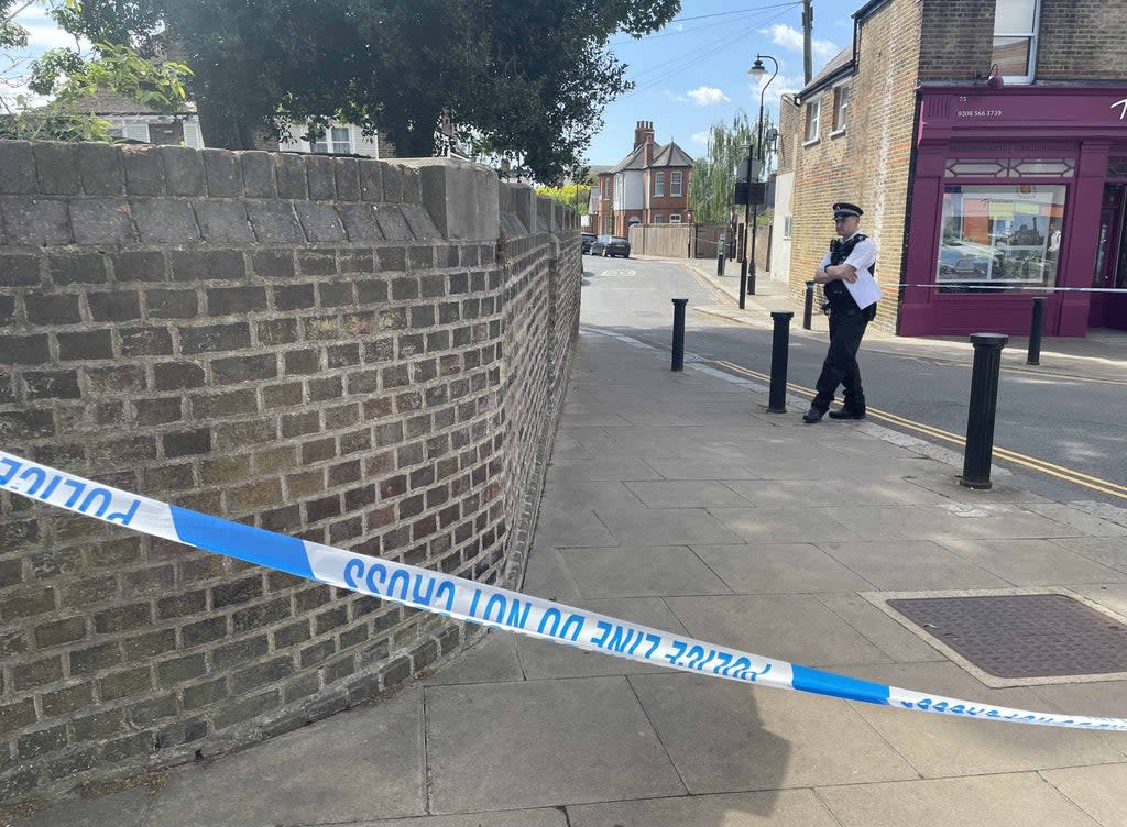 Police at the scene in Ealing, west London (Ted Hennessey/PA) (PA Wire)