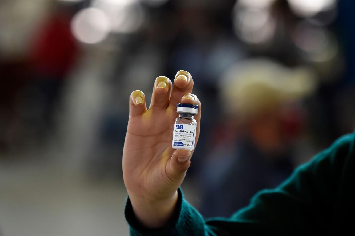 A nurse holds a vial of the Russian Sputnik V vaccine against COVID-19 at Sports Palace in Mexico City, on February 28, 2021.