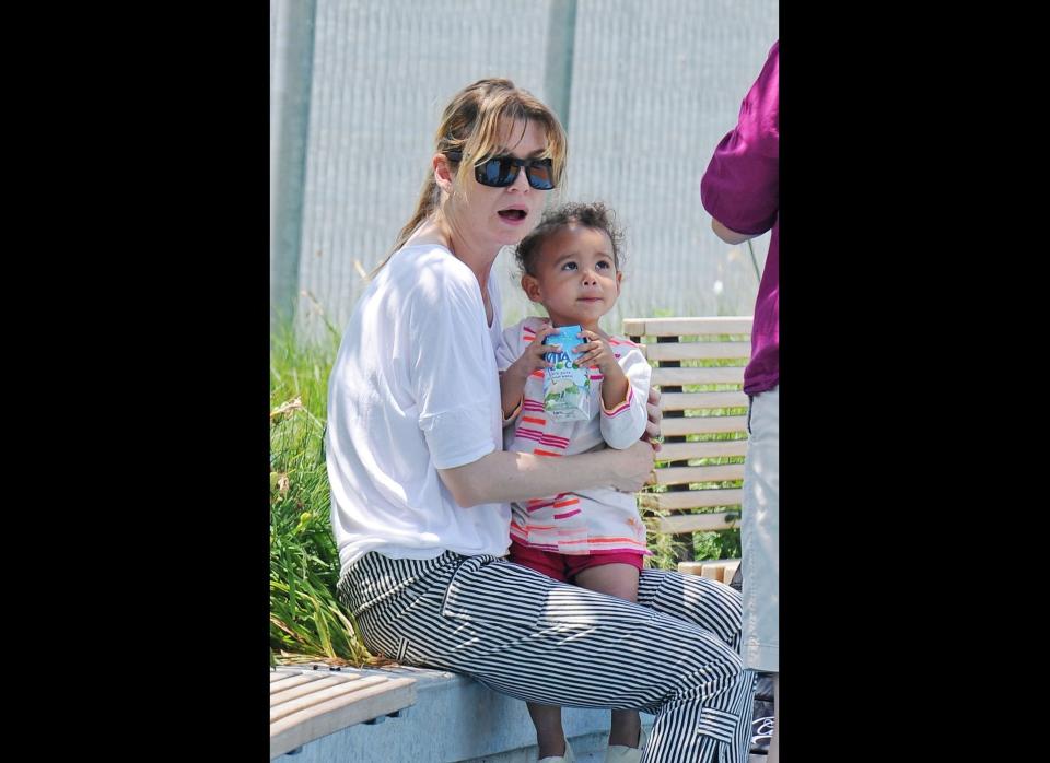 Ellen Pompeo holds on tight to her daughter Stella during a drink break from their play date in New York City on June 29, 2011.  