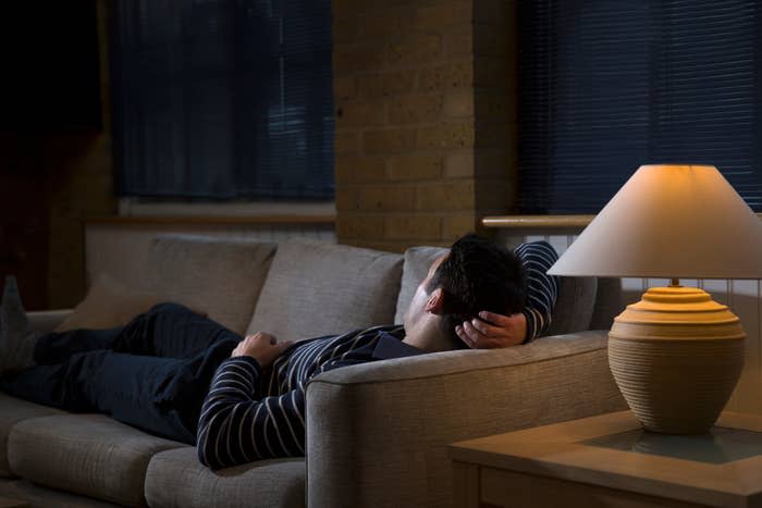 a person laying on the couch