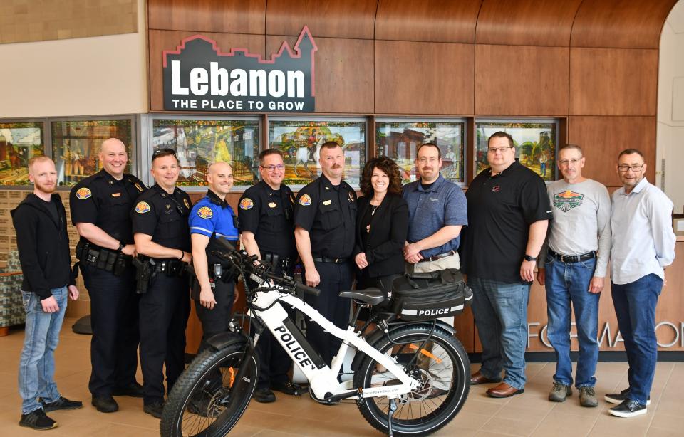 Members of the Lebanon City Police Department and city officials joined with the Lebanon Federal Credit Union, Bennet Williams and other community members to display the department's new Recon Interceptor electronic bike Monday morning.