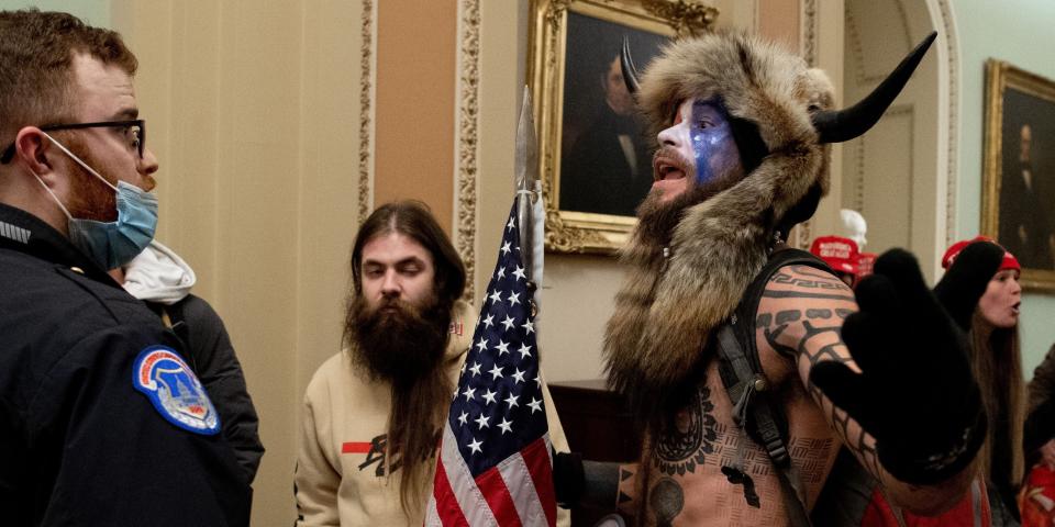 Qanon shaman viking riot capitol