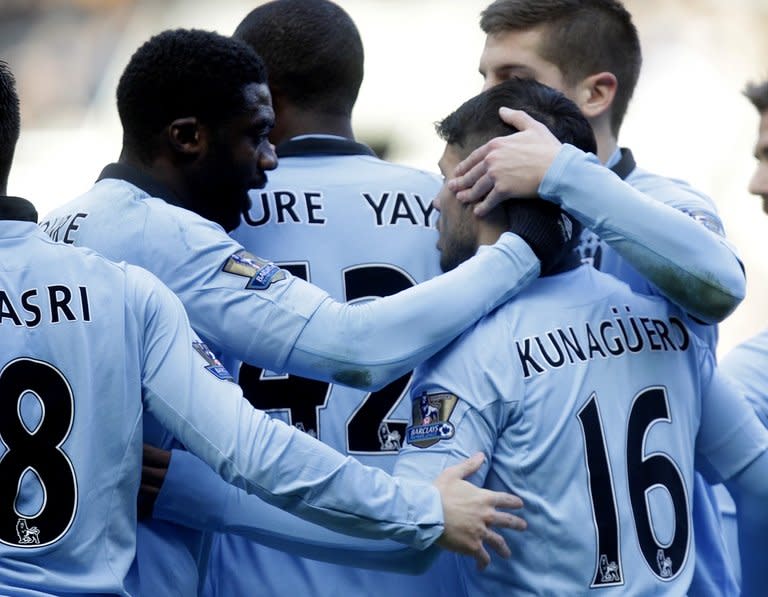 Manchester City's players celebrate scoring a goal against Newcastle United during their English Premier League match at St James Park, Newcastle upon Tyne, on December 15, 2012. City's bid to reel in league leaders Man United has been jeopardised by injuries to key players as they prepare to open their Christmas campaign at home to Reading on Saturday