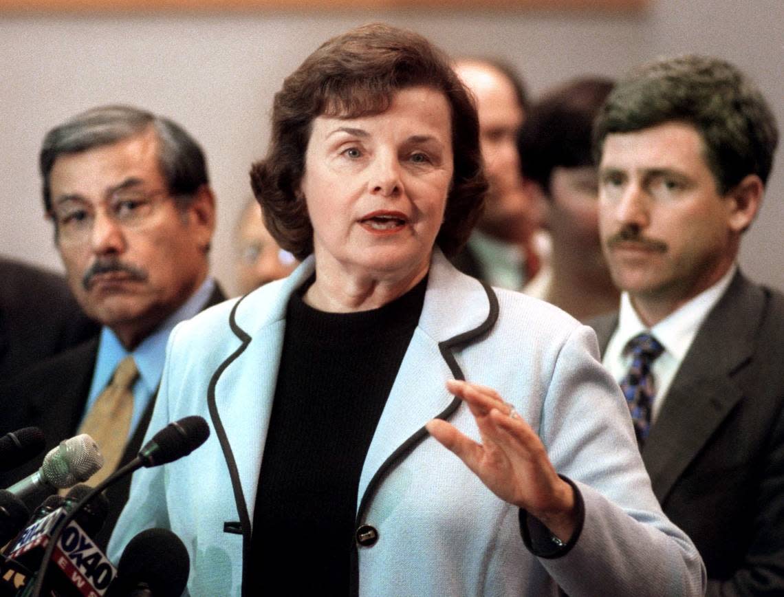 Sen. Dianne Feinstein speaks to the media after a meeting at Sacramento City Hall with city officials, including Mayor Joe Serna, left, and Councilman Steve Cohn, right, and community leaders on Aug. 10, 1999, to discuss hate crimes, gun legislation and related issues.