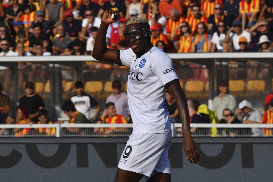 Napoli's Victor Osimhen celebrates after scoring during the Serie A soccer match between Lecce and Napoli at the Via del Mare stadium in Lecce, Italy, Saturday, Sept. 30, 2023. (Giovanni Evangelista/LaPresse via AP)