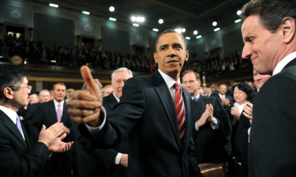 President Barack Obama walks down the center aisle greeting members of Congress on his way to deliver his State of the Union address on Capitol Hill in Washington on 27 January 2010.