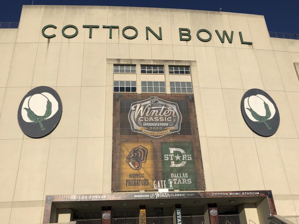 A shot from outside the iconic Cotton Bowl Stadium on Tuesday, Dec. 31, 2019 a day before the NHL hockey Winter Classic will be played there between the Dallas Stars and Nashville Predators on New Year's Day. It will be the southernmost outdoor game ever for the NHL, and the first outdoor game for both teams. It is the stadium known primarily for hosting the Red River college football rivalry game between Texas and Oklahoma each fall during the State Fair of Texas. (AP Photo/Stephen Hawkins)