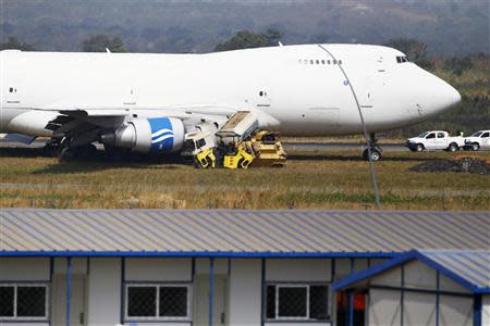 A Saudi Air Boeing 747 cargo aircraft is pictured after it overran the runway crashing into a tanker truck at the Nnamdi Azikiwe International Airport in Abuja December 5, 2013. REUTERS/Afolabi Sotunde