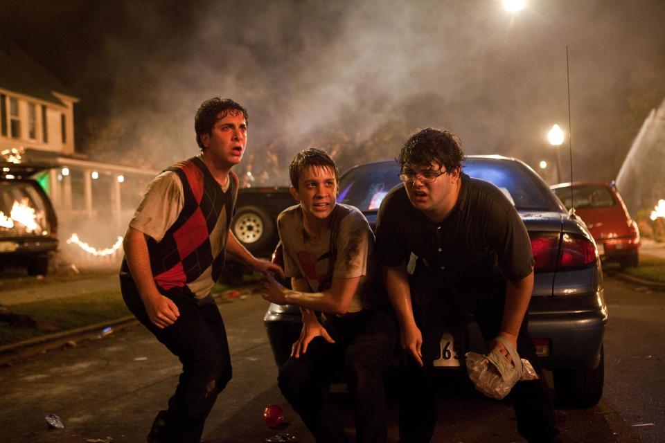 In this film image released by Warner Bros., from left, Oliver Cooper, Thomas Mann, and Jonathan Daniel Brown are shown in a scene from "Project X." (AP Photo/Warner Bros., Beth Dubber)