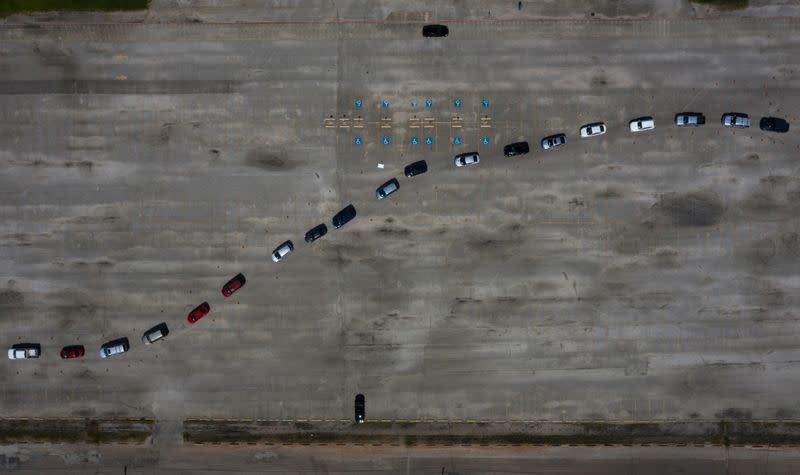 Residents line-up in vehicles to be tested amid global outbreak of coronavirus disease in Houston, Texas