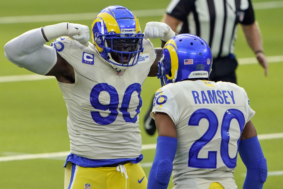 Los Angeles Rams defensive end Michael Brockers (90) celebrates with Jalen Ramsey (20) after Brockers tackled New York Jets running back Frank Gore during the first half of an NFL football game Sunday, Dec. 20, 2020, in Inglewood, Calif. (AP Photo/Jae C. Hong)