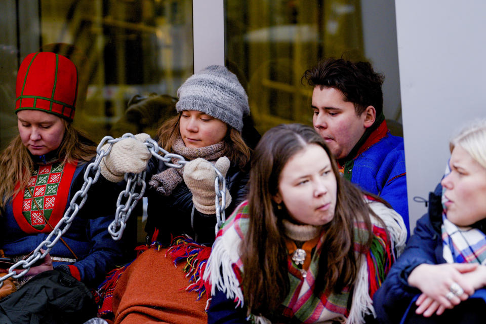 Greta Thunberg sits with others in front of the entrance to the Ministry of Trade and Fisheries during action against the wind turbines at Fosen, in Oslo, Norway, Thursday, March 2, 2023. The activists, mainly teenagers, have been blocking the entrance to several ministries in the Norwegian capital since Monday. They are protesting against a wind farm that’s still operating despite a ruling by Norway’s Supreme Court in October 2021 that the construction of the wind turbines violated the rights of the Sami, who have been using the land for reindeer for centuries.(Javad Parsa/NTB Scanpix via AP)