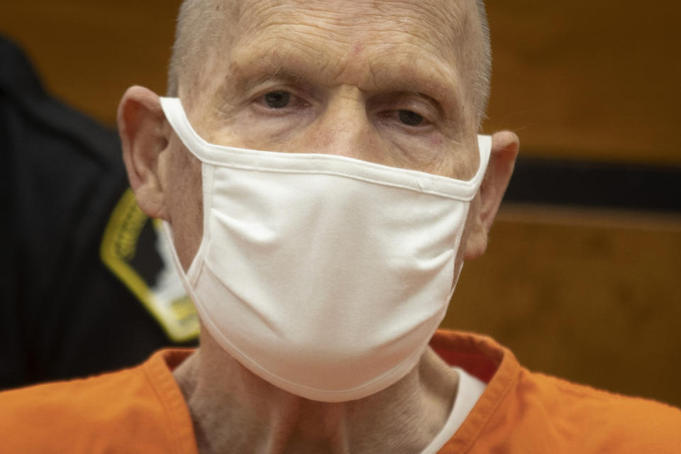 Joseph James DeAngelo looks away from the podium as people who DeAngelo victimized make their statements during the first day of victim impact statements at the Gordon D. Schaber Sacramento County Courthouse on Tuesday, Aug. 18, 2020, in Sacramento, Calif. DeAngelo will be formally sentenced to life in prison on Friday. The former police officer in California eluded capture for four decades. He has admitted 13 murders and nearly 50 rapes between 1975 and 1986. (Santiago Mejia/San Francisco Chronicle via AP, Pool)