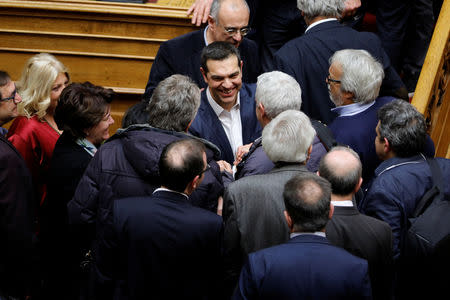 Greek Prime Minister Alexis Tsipras is congratulated by party lawmakers after winning a confidence vote in Athens, Greece, January 16, 2019. REUTERS/Alkis Konstantinidis