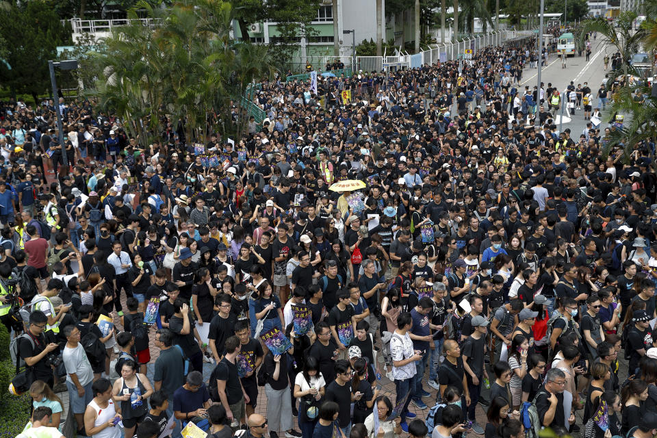 Protesters gather at Po Tsui park as they take part in the anti-extradition bill protests march in Hong Kong, Sunday, Aug. 4, 2019. Hong Kong police said Sunday that they arrested more than 20 people for unlawful assembly, assault and other offenses after confrontations between protesters and authorities continued deep into the night. (AP Photo/Vincent Thian)