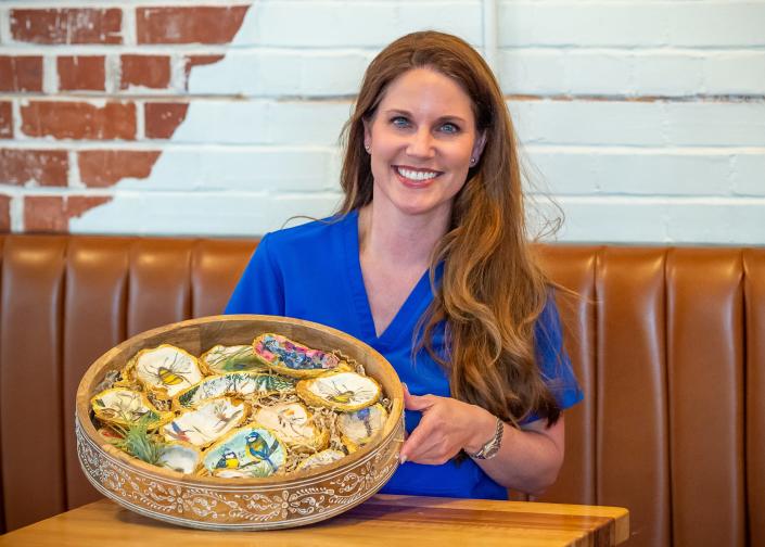 Dr. Julie Broussard, an anesthesiologist for Oschner Layette General, creates unique gold gilded oyster art on the side as Gold and Grit Designs. Thursday, June 9, 2022.