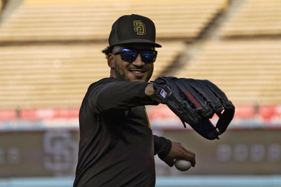 San Diego Padres' Trent Grisham warms up during baseball practice Monday, Oct. 10, 2022, in Los Angeles for the National League division series against the Los Angeles Dodgers. (AP Photo/Mark J. Terrill)