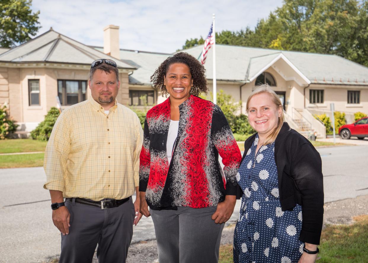 Recreation Director René Boudreau, Lane Library Director Amanda Reynolds-Cooper and assistant director Stacy Mazur pose for a photo outside the current library.