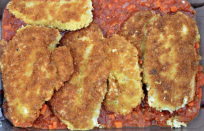 <p>Chicken Parmesan, or chicken Parmigiana, is a <a href="https://www.thedailymeal.com/eat/best-pasta-dish-every-state-slideshow?referrer=yahoo&category=beauty_food&include_utm=1&utm_medium=referral&utm_source=yahoo&utm_campaign=feed" rel="nofollow noopener" target="_blank" data-ylk="slk:quintessential Italian dish;elm:context_link;itc:0;sec:content-canvas" class="link ">quintessential Italian dish</a>. This slightly lighter take on the classic is made with a chunky homemade marinara sauce, pan-fried breaded chicken cutlets and thick slices of mozzarella cheese. The ingredients are layered and baked until the cheese is melted and bubbly.</p> <p><a href="https://www.thedailymeal.com/best-recipe/healthy-light-chicken-parmesan-recipe?referrer=yahoo&category=beauty_food&include_utm=1&utm_medium=referral&utm_source=yahoo&utm_campaign=feed" rel="nofollow noopener" target="_blank" data-ylk="slk:For the Chicken Parmesan recipe, click here.;elm:context_link;itc:0;sec:content-canvas" class="link ">For the Chicken Parmesan recipe, click here.</a></p>