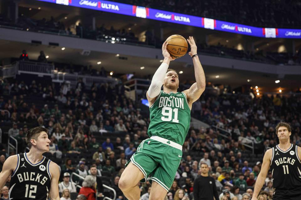 Boston Celtics forward Blake Griffin (91) drives against the Milwaukee Bucks during an NBA basketball game, Tuesday, Feb. 14, 2023, in Milwaukee. (AP Photo/Jeffrey Phelps)