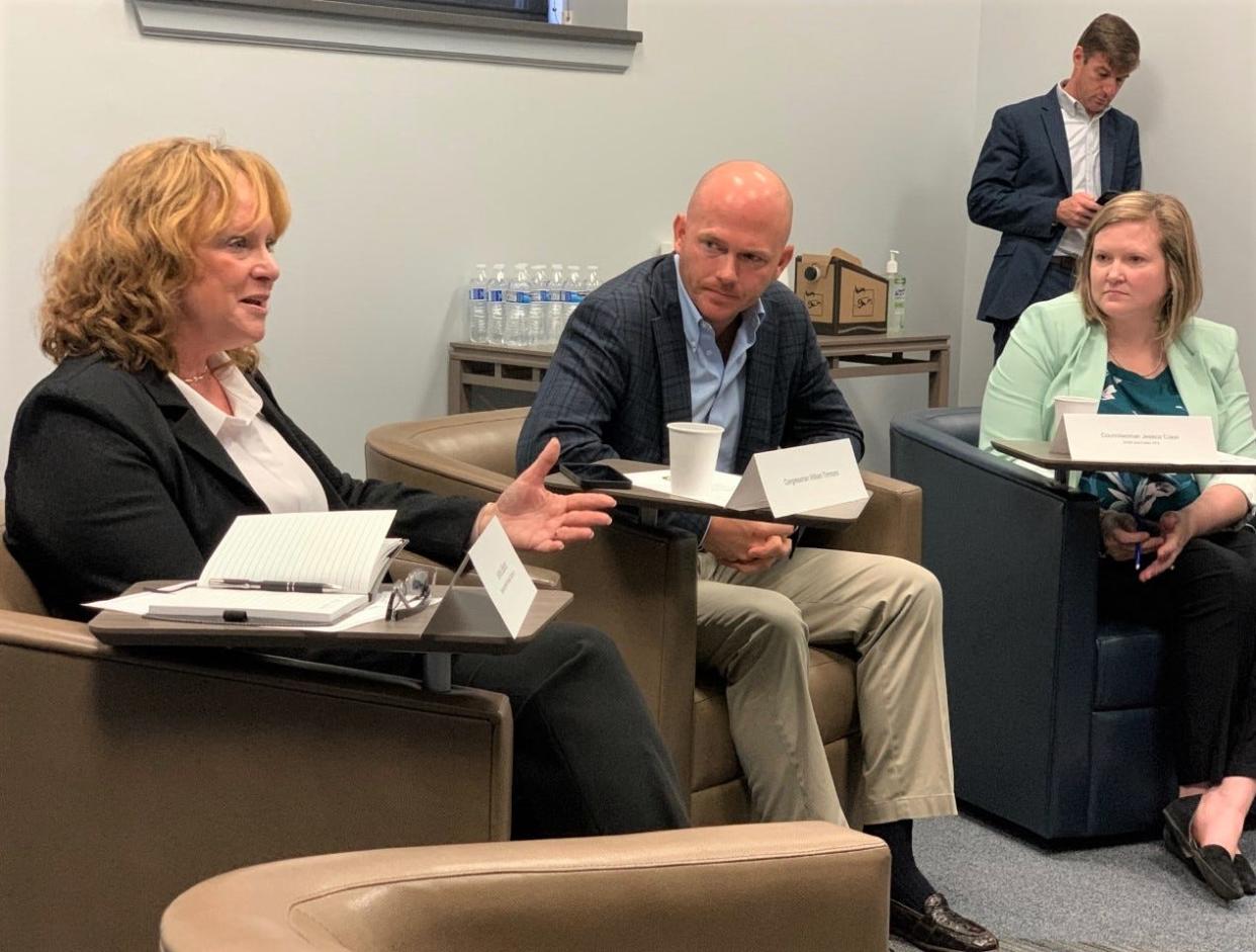 William Timmons heard from business leaders Tuesday during an Upstate Economy Roundtable at Spartanburg Community College's Downtown Campus. At left is JoAnne LaBounty of Spartanburg Meat Processing. At right is accountant Jessica Coker.