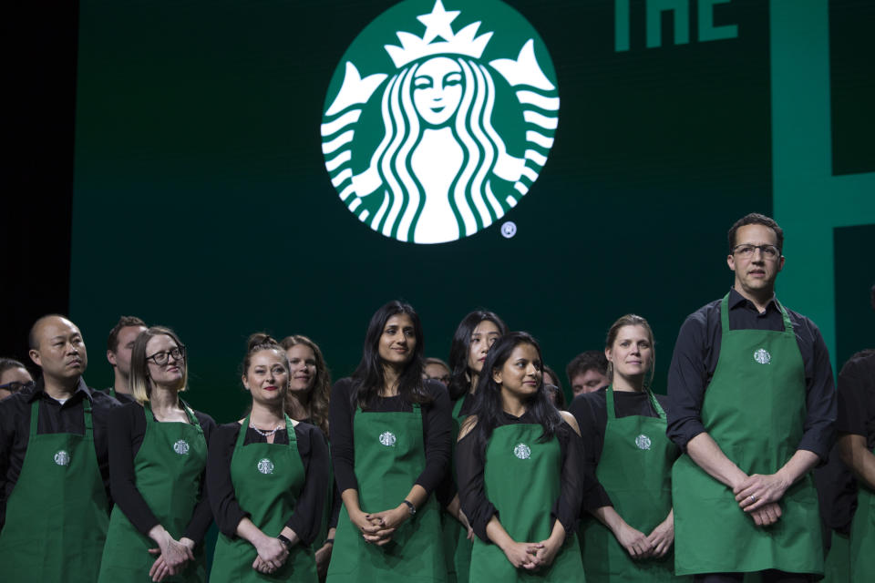 Starbucks employees are pictured on stage at the Annual Meeting of Shareholders in Seattle, Washington on March 20, 2019. (Photo by Jason Redmond / AFP)        (Photo credit should read JASON REDMOND/AFP via Getty Images)