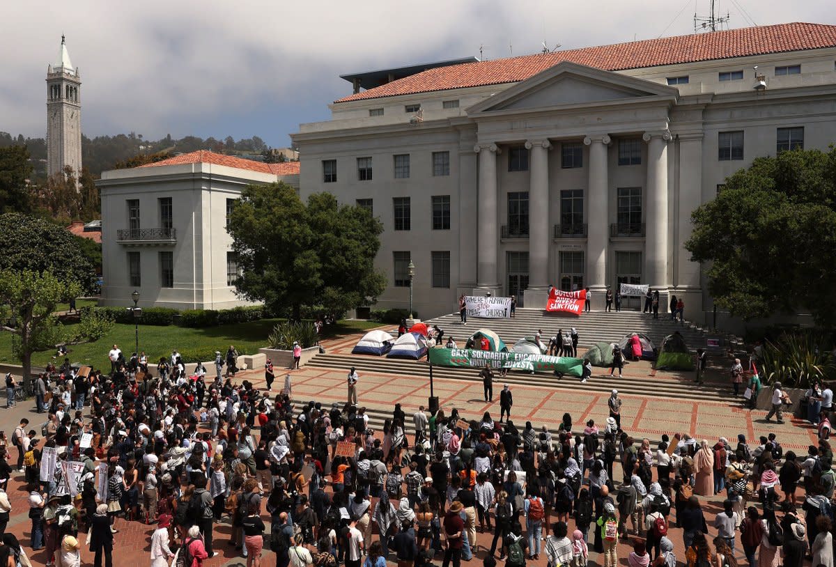 Pro-Palestinian protesters set up a tent encampment in front of Sproul Hall on the UC Berkeley campus on April 22, 2024.<span class="copyright">Justin Sullivan—Getty Images</span>