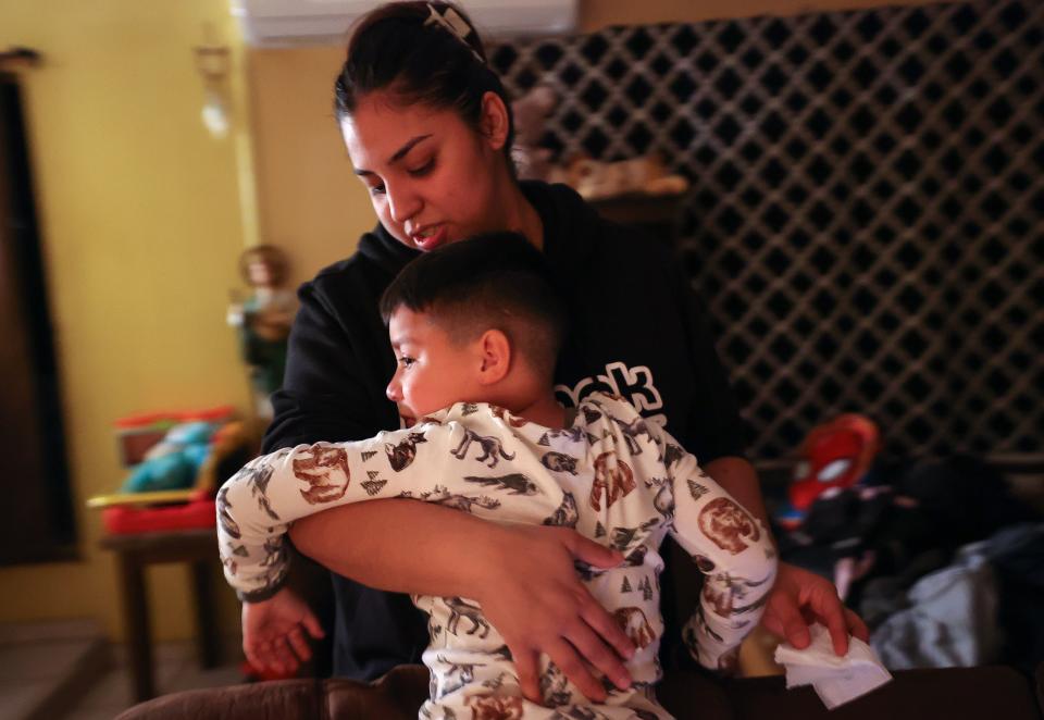 Rosa Mandujano comforts her son Ruben Mandujano, who is sick, at their home near the Salton Sea and Mecca, California, on Thursday, Dec. 14, 2023. Ruben, who is autistic and has asthma, has a hard time fighting infections. | Kristin Murphy, Deseret News