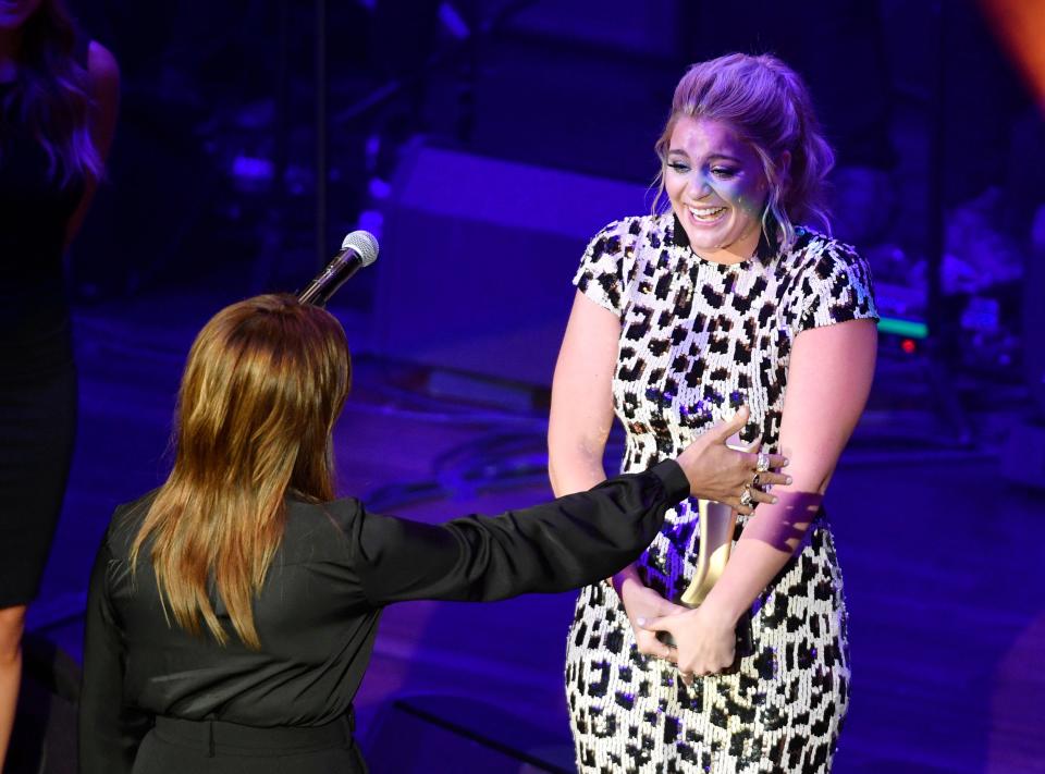 Lauren Alaina hands Martina McBride the Cliffie Stone Icon Award at the 13th Annual ACM Honors at the Ryman Auditorium on Aug. 21.