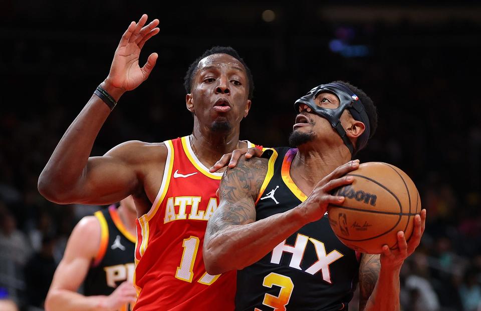 Bradley Beal #3 of the Phoenix Suns drives against Onyeka Okongwu #17 of the Atlanta Hawks during the second quarter at State Farm Arena on February 02, 2024 in Atlanta, Georgia.