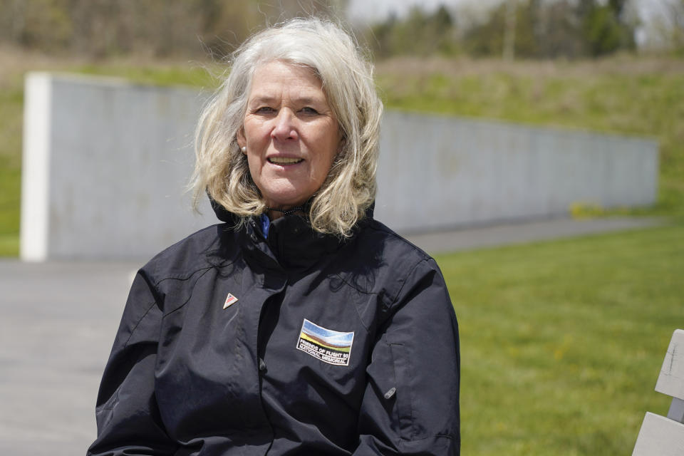 Donna Gibson, president of the Friends of Flight 93, talks about the new annual award for heroism as she sits in front of the Wall of Names at the Flight 93 National Memorial, Saturday, May 8, 2021, in Shanksville, Pa. The award aims to reward selfless acts of heroism, but also to educate the public on what happened when those aboard the hijacked plane learned of the attacks that had just occurred in New York and Washington D.C. The passengers and crew of Flight 93 then tried to wrest control of the aircraft they were on, which crashed into a field, leaving no survivors. (AP Photo/Keith Srakocic)