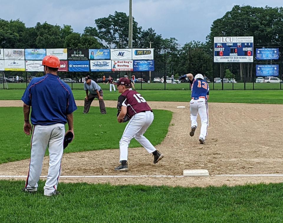 North County Post 129's Jayden Downing, center, keeps his eyes on the batter as Leominster Post 151's Evan McCarthy (13) attempts to steal second base in this TGN file photo from a July 2021 game in Leominster.