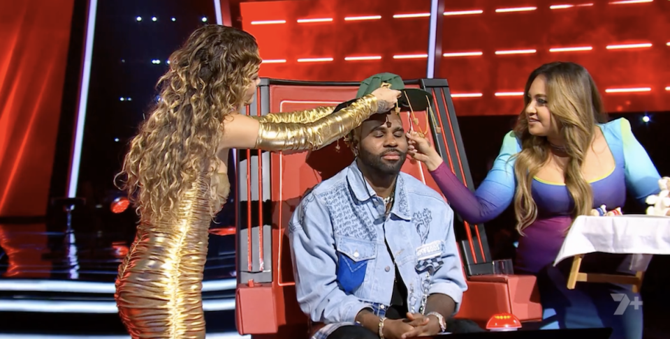 Jason Derulo wears a cork hat in preparation of taste-testing Tim Tams and Vegemite. 