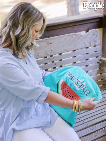 <p>Leslie Lynn Photography</p> Renee Beach with a Mal's Palz t-shirt