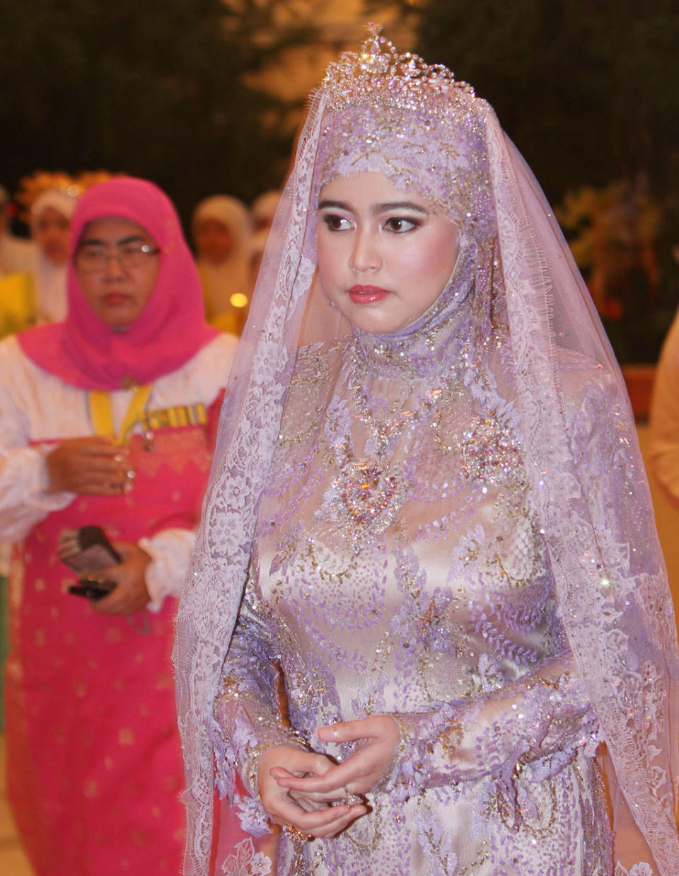 <div class="caption-credit"> Photo by: Wenn.com</div>In this photo, Princess Hajah Hafizah Sururul Bolkiah attends a ceremony ahead of the wedding. In Muslim countries like Brunei, "A wedding is a reflection of your family, culture and values," says Saukok Tiampo, founder of the <a rel="nofollow noopener" href="http://www.57grand.com/" target="_blank" data-ylk="slk:57Grand;elm:context_link;itc:0;sec:content-canvas" class="link ">57Grand</a> line of bridal wear and editor-in-chief of <a rel="nofollow noopener" href="http://www.revel-blog.com/" target="_blank" data-ylk="slk:Revel-Blog.com;elm:context_link;itc:0;sec:content-canvas" class="link ">Revel-Blog.com</a>. "Its different from an American wedding, which reflects more on yourselves and your love for each other." The princess is the fifth child of the Sultan and his wife, Queen Saleha. <br>