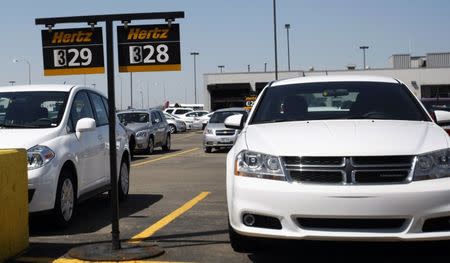 Hertz rental cars are seen in a rental lot near Detroit Metropolitan airport in Romulus, Michigan, May 9, 2011. REUTERS/Rebecca Cook