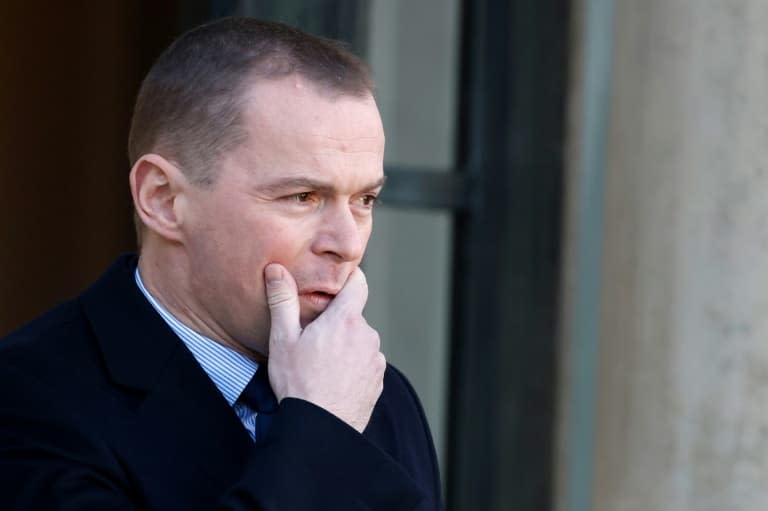 Le ministre du Travail Olivier Dussopt quitte le palais de l'Elysée à Paris le 18 janvier 2023 - Ludovic MARIN © 2019 AFP