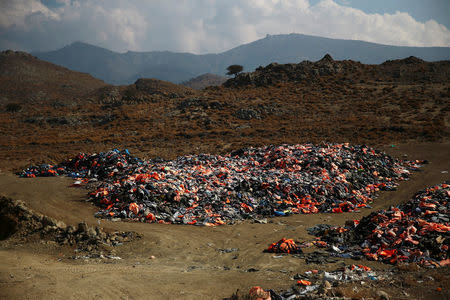 Thousands of lifejackets left by migrants and refugees are piled up at a garbage dump site near the town of Mithymna (also known as Molyvos) on the island of Lesbos, Greece, October 5, 2016. REUTERS/Alkis Konstantinidis