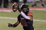 Utah linebacker Nephi Sewell scores after recovering a Southern California fumble during the first half of an NCAA college football game Saturday, Nov. 21, 2020, in Salt Lake City. (AP Photo/Rick Bowmer)