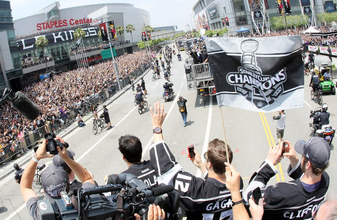 LOS ANGELES, CA - JUNE 14: Simon Gagne #12 of the Los Angeles Kings waves to fans during the Los Angeles Kings Stanley Cup Victory Parade on June 14, 2012 in Los Angeles, California. (Photo by Victor Decolongon/Getty Images)