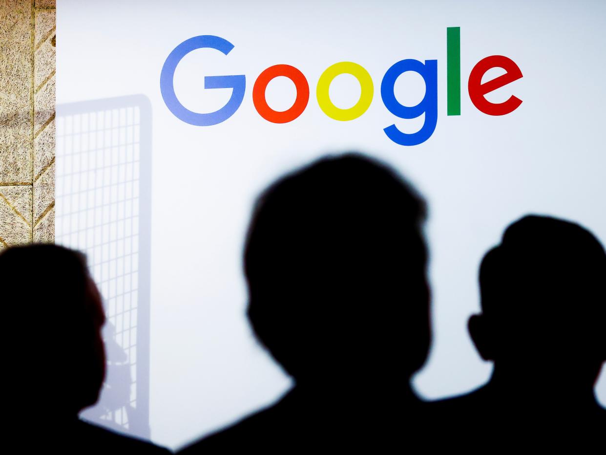 Google logo with faces silhouetted