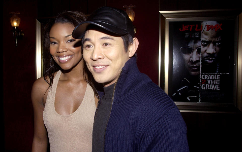 Gabrielle Union and Jet Li posing for picture.