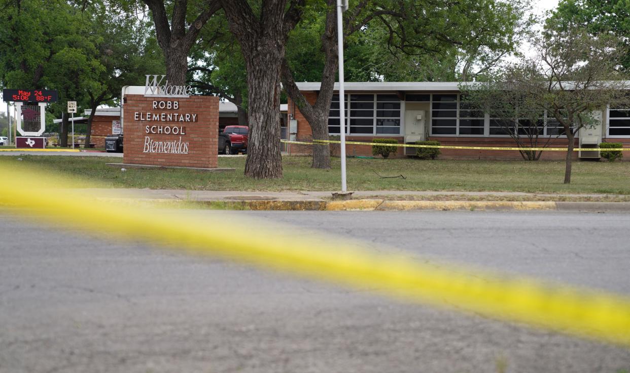 Sheriff crime scene tape is seen outside of Robb Elementary School as State troopers guard the area in Uvalde, Texas, on May 24. 