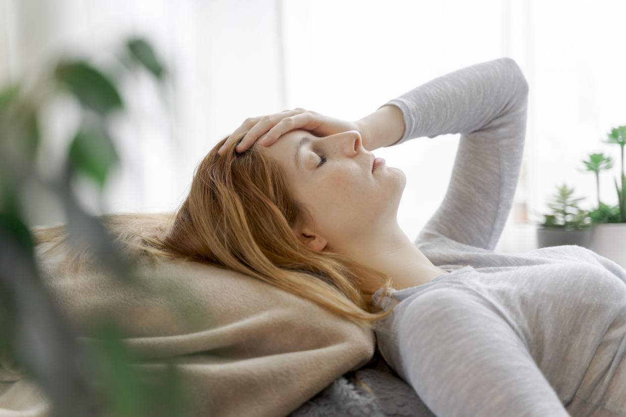 Symptoms like fatigue, brain fog and muted senses demonstrate how the coronavirus can affect the brain. (Posed by a model, Getty Images)