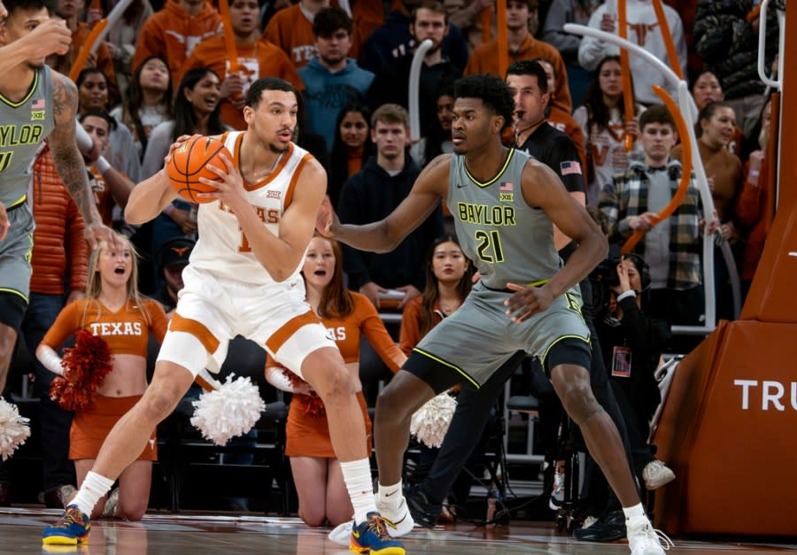Texas forward Dylan Disu, left, plays against Baylor forward Yves Missi, right, during the first half of an NCAA college basketball game, Saturday, Jan. 20, 2024, in Austin, Texas. (AP Photo/Michael Thomas)