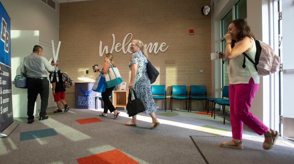 Teachers and students arrive for classes on the first day of school at the new East Bay K-8 school in Santa Rosa County in this  Aug. 10, 2021, file photo.