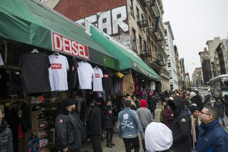 People wait to enter the "Deisel" boutique in New York, where the real thing masquerades as knock-off
