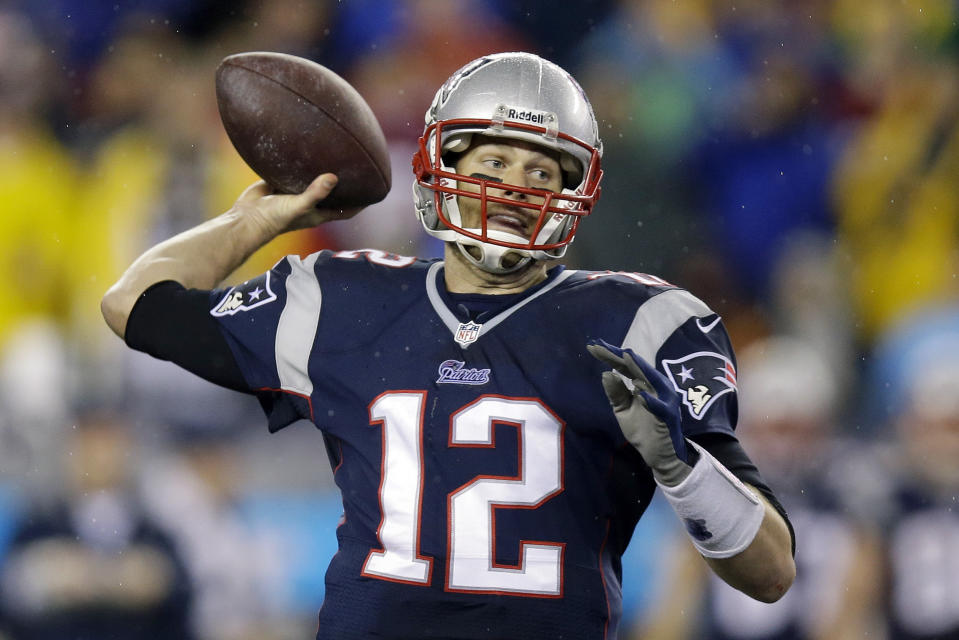 New England Patriots quarterback Tom Brady passes the ball during the second half of an AFC divisional NFL playoff football game against the Indianapolis Colts in Foxborough, Mass., Saturday, Jan. 11, 2014. (AP Photo/Stephan Savoia)