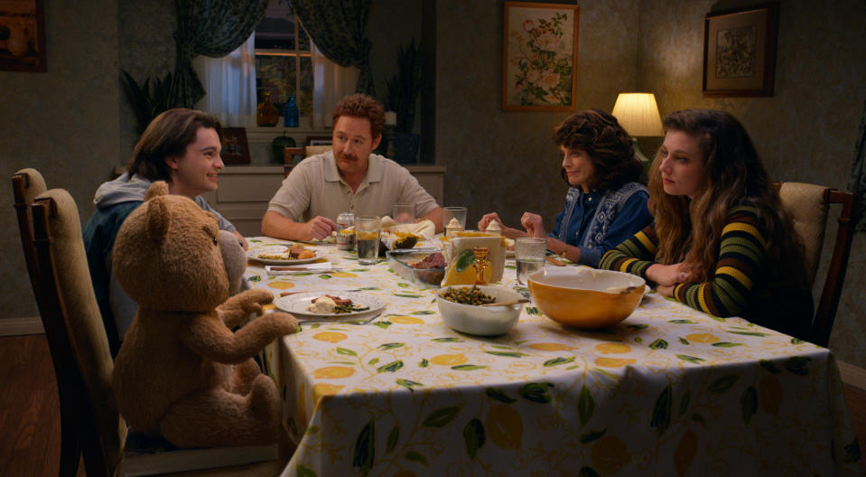 TED -- "Just Say Yes" Episode 101 -- Pictured: (l-r) Seth MacFarlane as voice of Ted, Max Burkholder as John, Scott Grimes as Matty, Alanna Ubach as Susan, Giorgia Whigham as Blaire — (Photo by: PEACOCK)